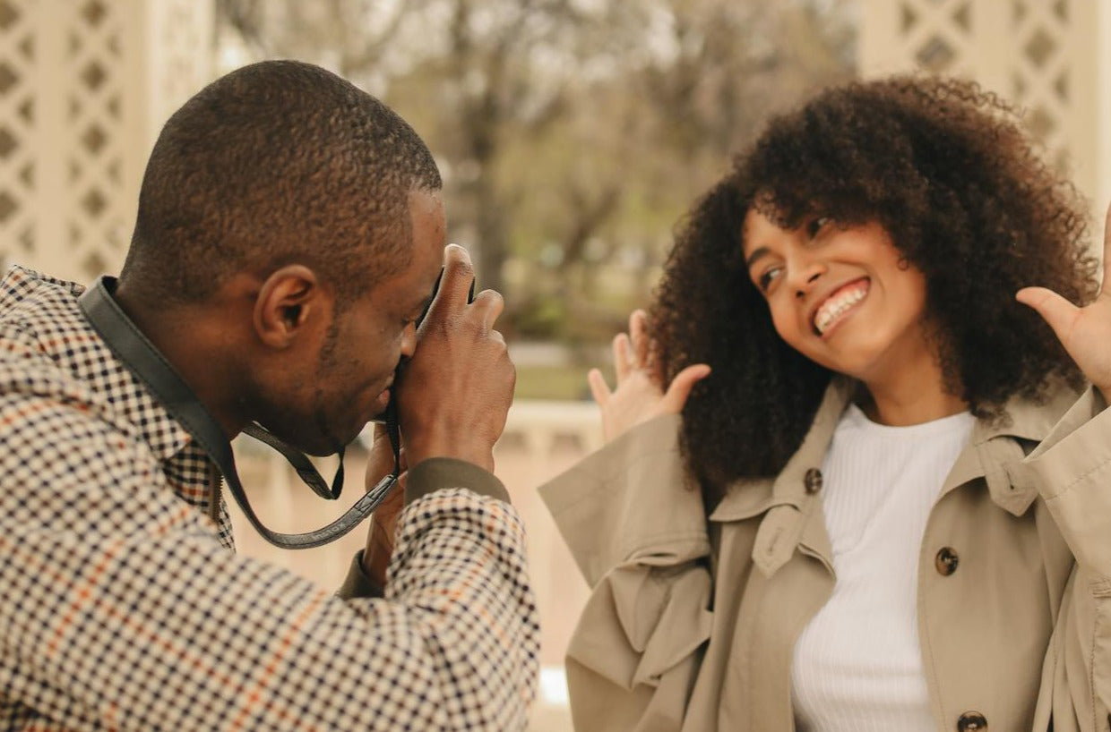 Man taking picture of woman